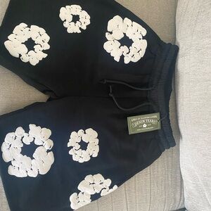 Denim Tears Black Shorts with White Floral Design
